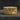 Gold-plated Last Supper Ring with high-relief carvings of the biblical scene and beaded edges, displayed on a dark stone surface.