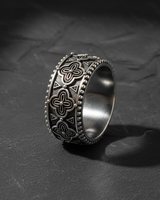 Close-up of geometric floral details on handcrafted sterling silver ring for men and women