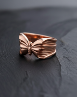 Rose gold plated sterling silver butterfly ring with detailed wing texture on dark background for elegant nature jewelry style