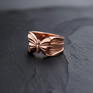 Rose gold plated sterling silver butterfly ring with detailed wing texture on dark background for elegant nature jewelry style