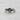 Close-up detail of sparkling stone setting and heart design on polished sterling silver promise ring jewelry piece