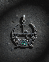Top-down view of silver triple moon goddess necklace showing intricate Lilith symbol and blue opal inlay protection amulet