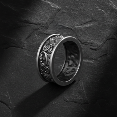 Angled perspective of 925 sterling silver ornamental ring showing thick band profile and oxidized finish details