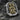 Side angle of sterling silver ring showing Saint Christopher figure and floral filigree shank