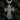 Close-up of intricate relief work on silver religious cross pendant showing Saints and Cyrillic inscriptions