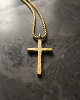 Gold vermeil variation of rustic cross pendant necklace showing textured surface and chain detail