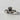 Straight angle shot of silver friendship ring with crowned heart and hands symbolizing love and loyalty