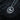 Front view of silver Taurus horoscope necklace with textured bull design on dark background