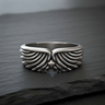 Front view of 925 sterling silver wing ring showing intricate feather texture and symmetrical biker style design