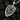 St. George Shield Pendant, two-tone finish, angled view on charcoal