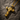 14K gold vermeil silver cracked cross pendant featuring black stones and rugged texture on dark stone background