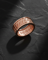 Rose gold plated silver ring with dragon skin pattern showing detailed relief work and smooth inner band comfort fit