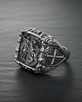 Angled close-up of handcrafted 925 silver ring with Saint George text and intricate religious engraving