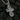 Reverse side of silver Christian pendant featuring intricate Orthodox church cathedral engraving and script