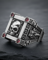 Angled view of gothic skull design and oxidized finish on premium sterling silver square ring