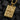 Gold vermeil King of Spades pendant featuring detailed relief carving displayed on black coal background