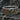 Two-tone vintage style ring featuring gold scroll details on silver band side view