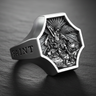 Detailed 925 sterling silver Archangel Michael ring featuring St Michael defeating Satan relief on black textured surface