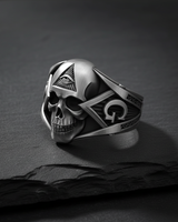 Angled view of masonic skull ring showing the Square and Compasses symbol with letter G on the shank and oxidized finish