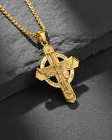 Close-up of gold vermeil St. Michael necklace showing sword and shield details on dark stone