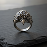 Front view of handcrafted 925 sterling silver eagle ring with detailed feathers on dark stone background