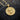 Gold plated variation of religious Jesus pendant necklace displayed on charred wooden background