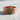 Close-up of the rose gold plated emerald bark ring detailing the meticulously crafted tree bark finish and vibrant emeralds