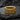 Rose gold vermeil Silver Fleur-de-lis Ring with milgrain edges, casting a shadow on a textured black surface.