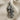 Ornamental Skull Pendant, oxidized, front view on fabric