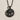 Virgo Zodiac Medallion Pendant, black rhodium, front view on textured surface