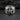 Wide 925 sterling silver nautical star ring resting on a dark textured stone background highlighting the bold band