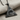 Celestial All-Seeing Eye Pendant, black rhodium plated, angled view on fabric