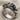Cannabis Angel Ring, oxidized, angled view on fabric