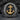 Angled close-up of handcrafted Navy anchor ring showing the 1775 side engraving against a dark textured stone backdrop