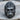 Close-up of premium silver gorilla head ring resting on rustic wood, highlighting the intricate facial scar and nose ring.