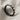 Faceted Rhombus Ring, angled perspective view on linen fabric