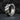 Modern 925 sterling silver men's hoop earring resting on a dark textured stone background highlighting the beveled edges
