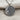 Macro view of oxidized silver celestial jewelry highlighting the stippled night sky texture and vintage finish