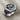 Pug Dog Ring, oxidized silver, angled view showing faceted shoulders