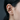 Side profile view of oxidized silver feather ear cuff worn comfortably on the ear cartilage without a piercing