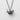 Close-up of the handcrafted oxidized silver origami crane pendant showing detailed relief fold lines