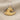 Two-tone ocean wave pendant with luxurious 14K gold vermeil front and oxidized silver backing on soft natural fabric