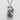Maneki Neko Pendant, oxidized, front view on stone surface