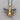 Close-up of the oxidized silver honey bee pendant resting on a wooden surface highlighting intricate wing textures