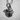 Close-up of the oxidized silver anatomic heart pendant showing intricate veins, arteries, and Cupid's arrow.