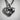 Close-up detail of the dolphin heart pendant highlighting intricate oxidized silver craftsmanship and deep shading