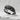 Feather Wrap Ring, black rhodium, angled view on white stone