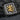Close-up of handcrafted 925 silver Raijin ring on dark rock showing detailed gold figure, lightning bolts and kanji engraving