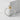 Japanese Onigiri Ring, two-tone finish, upright view on textured concrete