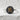 Close-up of heaven kanji ring on white texture, highlighting the intricate gold relief and oxidized silver